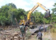 Alat Berat Dikerahkan, Satgas TMMD ke-124 Genjot Pembangunan Jalan di Desa Talio